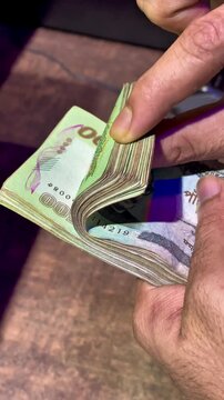Hands Fast Counting Stack of Bangladeshi Taka Banknotes &ndash; Cash Money Finance Concept