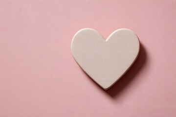 Fototapeta premium Simple heart shape in soft pink color, suitable for St Valentine’s Day background decoration