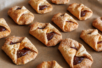 Fototapeta premium Homemade jam-filled puff pastry cookies fresh from the oven