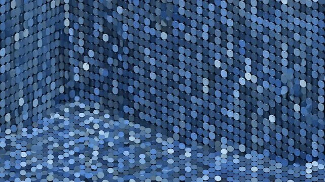 An abstract composition featuring a wall of blue sequins cascading onto a pile below.