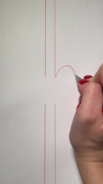Vertical video of two parallel red lines drawn toward the center, each line forming half of a heart shape. Together, they create a complete heart. Hand-drawn red pen animation on a white background. C