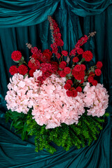 Vertical Wedding Decoration with Pink Hydrangeas and Red Flowers on Green Velvet