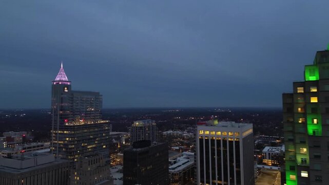 Aerial panning view of the Raleigh , North Carolina skyline at night