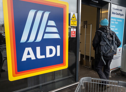 London. UK- January 11. 2026. The Aldi grocery supermarket name sign and logo by the entrance of one of its stores.
