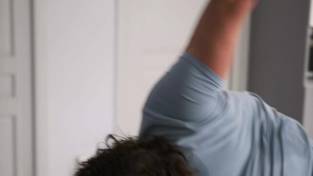 Caucasian man performing bentover rows with dumbbells, legs and hands captured in detail on blue mat, precise hinge, studio apartment flooring, emphasis on muscle engagement and controlled pull