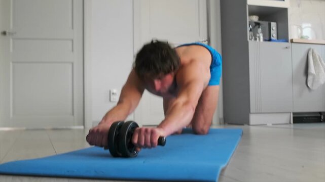 Man trains vigorously indoors, Individual performs strenuous exercises within limited kitchen environment, Dedicated person vigorously engages core muscles during intense indoor workout session