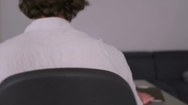 Man multitasks efficiently, Man handles gadgets during work, Person swiftly manages multiple electronic devices, Man rapidly juggles numerous electronic tools while dining and meeting deadlines