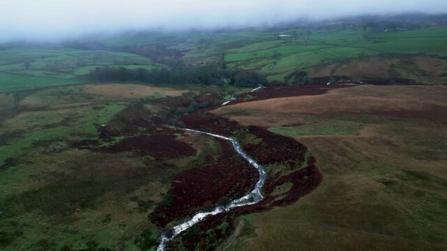 Aerial shot foggy day over Cawdale Beck in Brampton Cumbria UK 54.554784, -2.788044