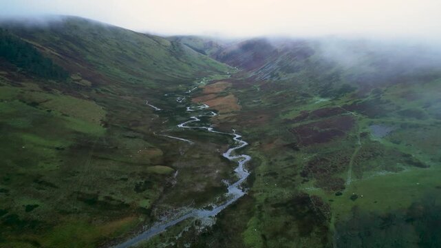 Aerial shot foggy day over Cawdale Beck in Brampton Cumbria UK 54.554784, -2.788044