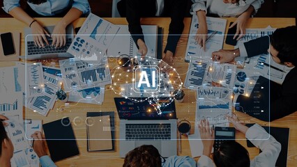 A diverse business team engages in a collaborative session focused on leveraging artificial intelligence to analyze data, utilizing charts and modern technology for insights. Raster