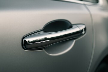 View of car door handle urban environment automotive detail modern design