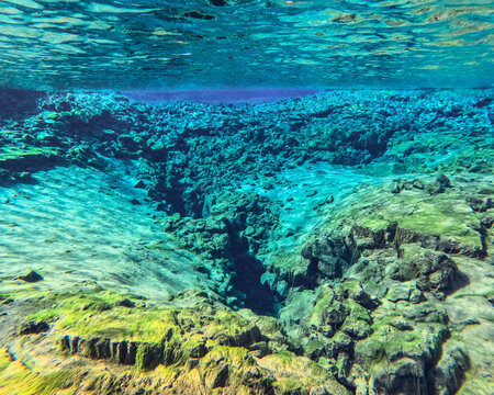 Silfra is a fissure between the North American and Eurasian tectonic plates in Thingvellir National Park, Iceland, 