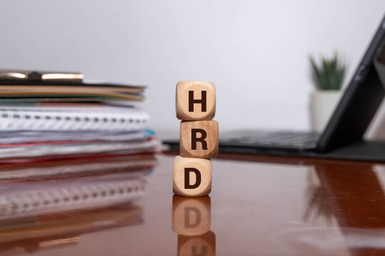 hrd word written on a wooden block in the background.