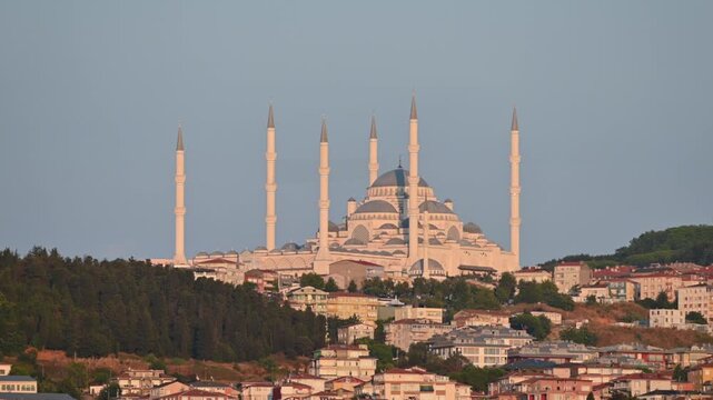 Istanbul,turkey,august 4, 2025. Majestic buyuk camlıca mosque standing on a hill in istanbul, turkey. The impressive islamic architecture glowing at sunset over the city