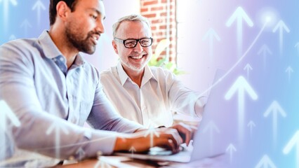 Cheerful web developers working on a laptop