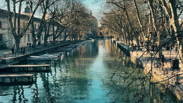 Canal With Clear Water and Boats in Annecy Old Town on Winter Day, France