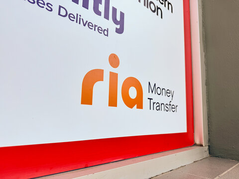 Ria Money Transfer logo, owned by Euronet Worldwide, on the facade of a self-service store. International remittance sending and receiving point. Mexico, January 21, 2026