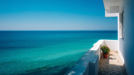 Obraz premium Relaxation on a hotel balcony overlooking turquoise water and clear sky with modern terrace design for vacation enjoyment