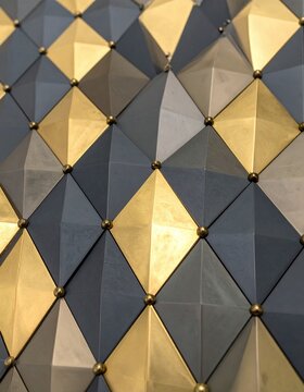 Abstract geometric pattern with gold and gray diamond shapes.