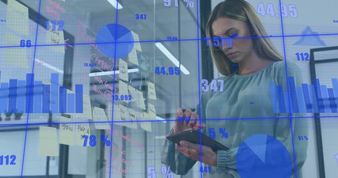 Analyst opening cover, tapping tablet, checking notes while business charts overlaying for planning