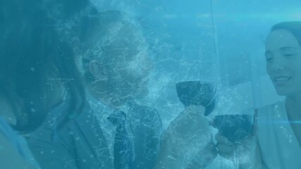 Senior man raising goblet, business team clinking cups toasting deal, blue overlay covering frame