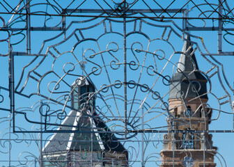 Decorative iron ornament and cathedral view at background, penaranda de bracamonte, spain