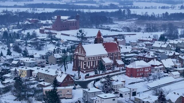 Aerial winter Teutonic church and castle Radzyn Poland. Brick Gothic monastery castle built 1234 AD, Teutonic Knights. Northern royal town.  Historical buildings. Saint Anne church 12th century.