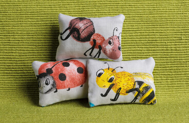 Cushions with insects on sofa