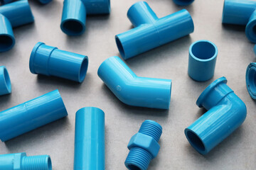Plumber equipment with blue pvc pipe connections for plumbing work.