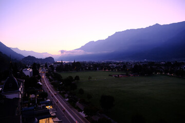 Obraz premium High-angle view of Interlaken town and Swiss alps under a purple dawn sky in Switzerland