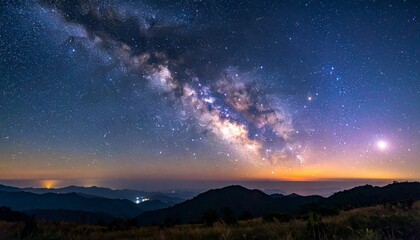 Obraz premium Milky Way over the mountains - A celestial spectacle of stars.