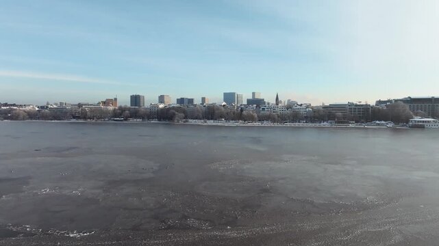 Aerial view of the wintery, frozen Outer Alster in Hamburg covered with heavy snow