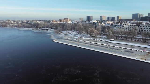 Aerial view of the wintery, frozen Outer Alster in Hamburg covered with heavy snow