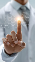 A doctor's hand touches a digital screen button. Healthcare network and modern medicine technology in a hospital