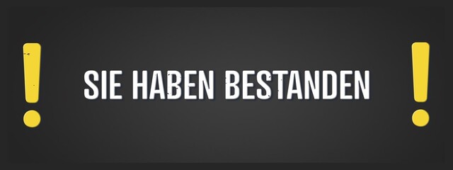 Sie haben bestanden (You passed) - A blackboard illustration with white text. © lhphotos
