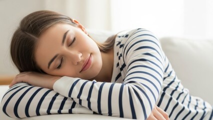 A young woman enjoys a peaceful nap, finding comfort and serene rest on a soft sofa
