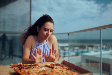 Woman Can Not Eat Anymore and Refuses Pizza. Squeamish fussy eater refusing a good meal  

