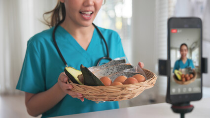 Asia woman people anti aging expert modern health care vlogger live advice talk selfie video mobile phone camera. Online diet food weight loss HDL meal plan recipe digital virtual asian coach filming.