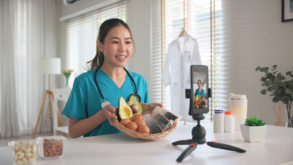Asia woman people anti aging expert modern health care vlogger live advice talk selfie video mobile phone camera. Online diet food weight loss HDL meal plan recipe digital virtual asian coach filming.