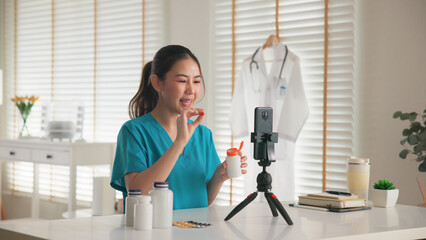 Asia woman people anti aging expert modern health care vlogger live advice talk selfie video mobile phone camera. Online retail diet weight loss digital virtual asian filming vitamin c pill drug store