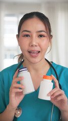 POV Asia woman people anti aging expert modern health care live advice talk selfie video phone call look at camera. Online retail diet weight loss digital virtual asian filming vitamin pill drug store