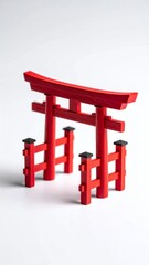 Red Torii Gate Miniature on White Background.