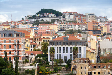 Fototapeta premium Lisbon waterfront cityscape with cargo ship on river