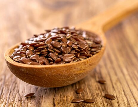 Wooden Spoon Filled with Nutritious Flax Seeds on Rustic Table.