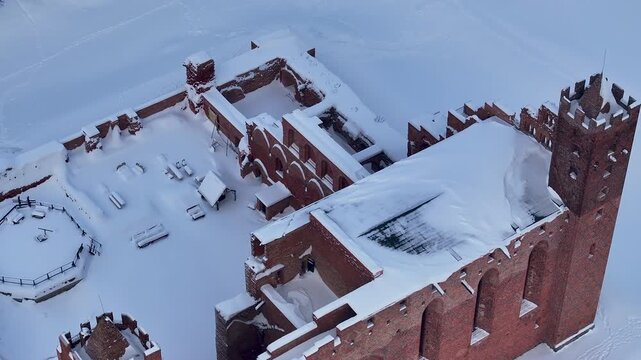 Aerial winter Teutonic Castle Radzyn Poland overhead 3. Brick Gothic monastery castle built 1234 AD, Teutonic Knights. Northern royal town.  Historical buildings. Saint Anne church 12th century.