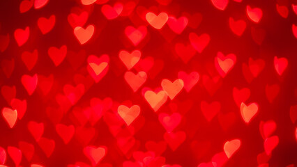 Romantic red heart bokeh lights creating a beautiful abstract background for love