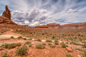 A desert landscape with a mountain in the background