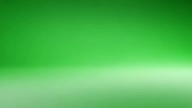 Green background with gradient effect on studio wall and floor