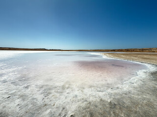 Salt lake with mineral deposits in protected desert landscape
