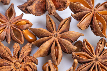 Richly textured star anise pods, Closeup of glossy starshaped spice pods, Detailed image showcasing...
